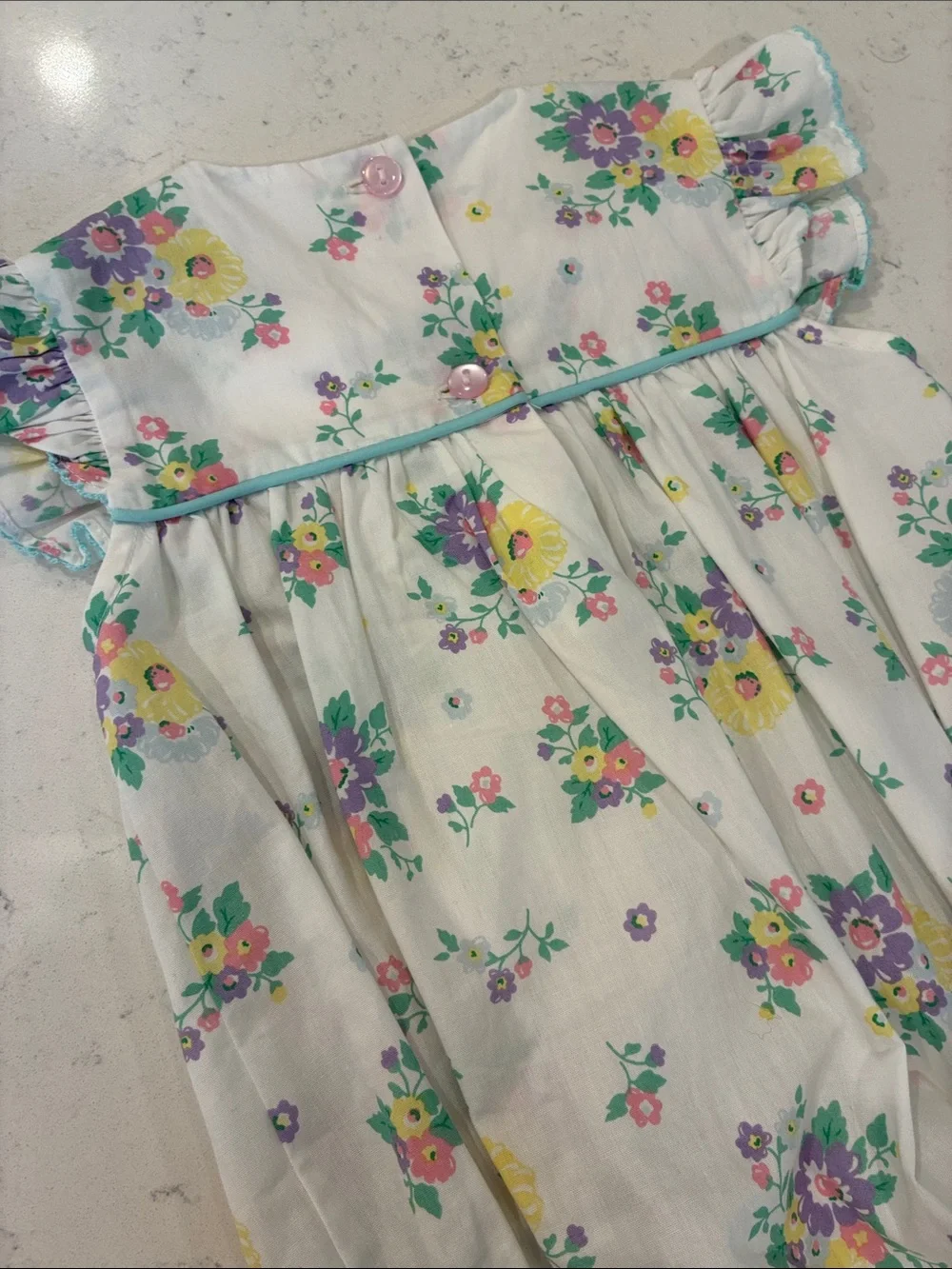 Floral Smocked Baby Romper - White with Yellow, Purple & Green Flowers